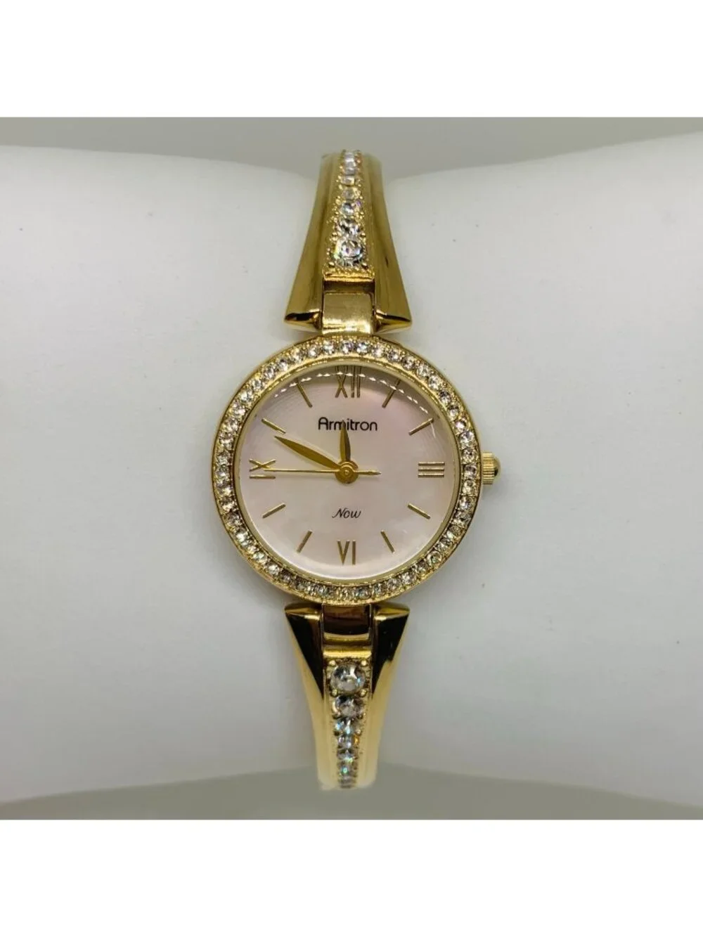 Armitron women’s watch gold tone 24mm mop dial quartz rhinestones running